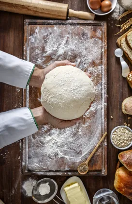 hands kneading bread