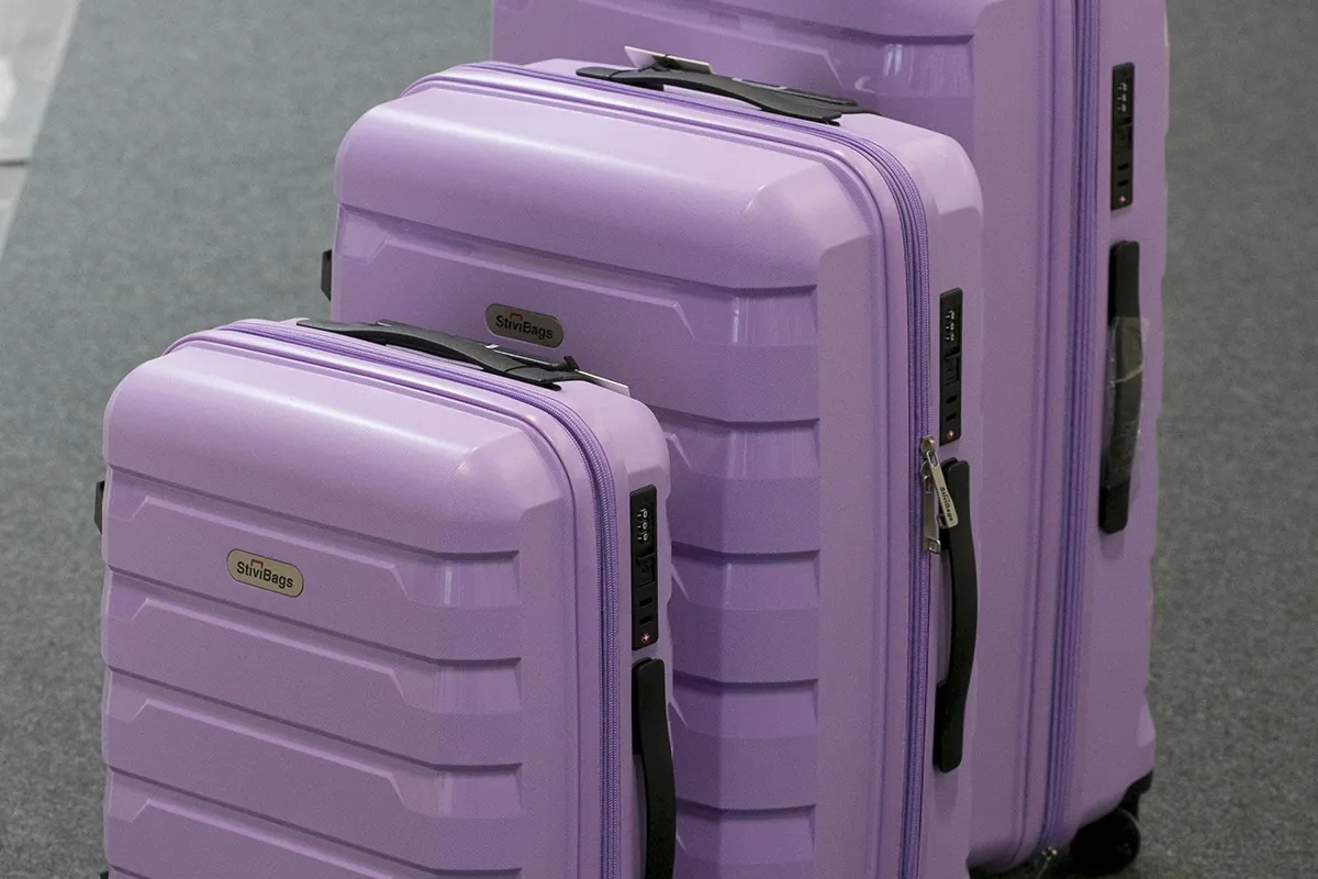 Purple suitcases at bisutex