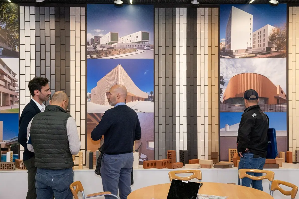 People viewing constructions at a stand