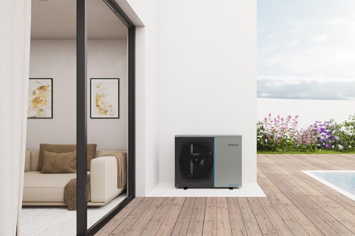 Domusa Teknik heat pump outside a house