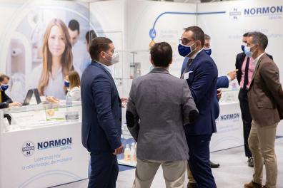 Visitors talking to an exhibitor
