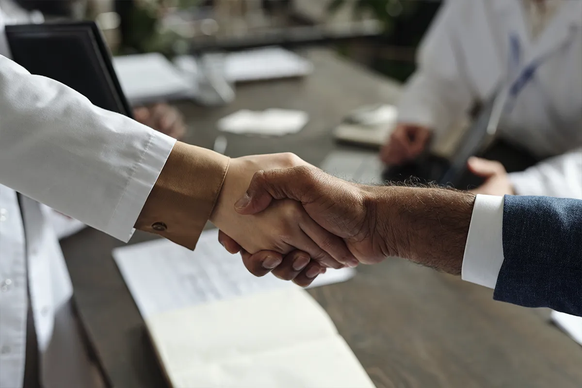 Handshake agreement between a doctor and a patient