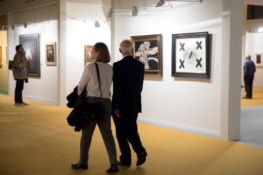 Visitors admiring the works exhibited at the fair