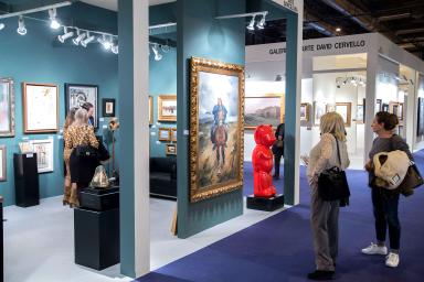 Visitors observing the works of the fair