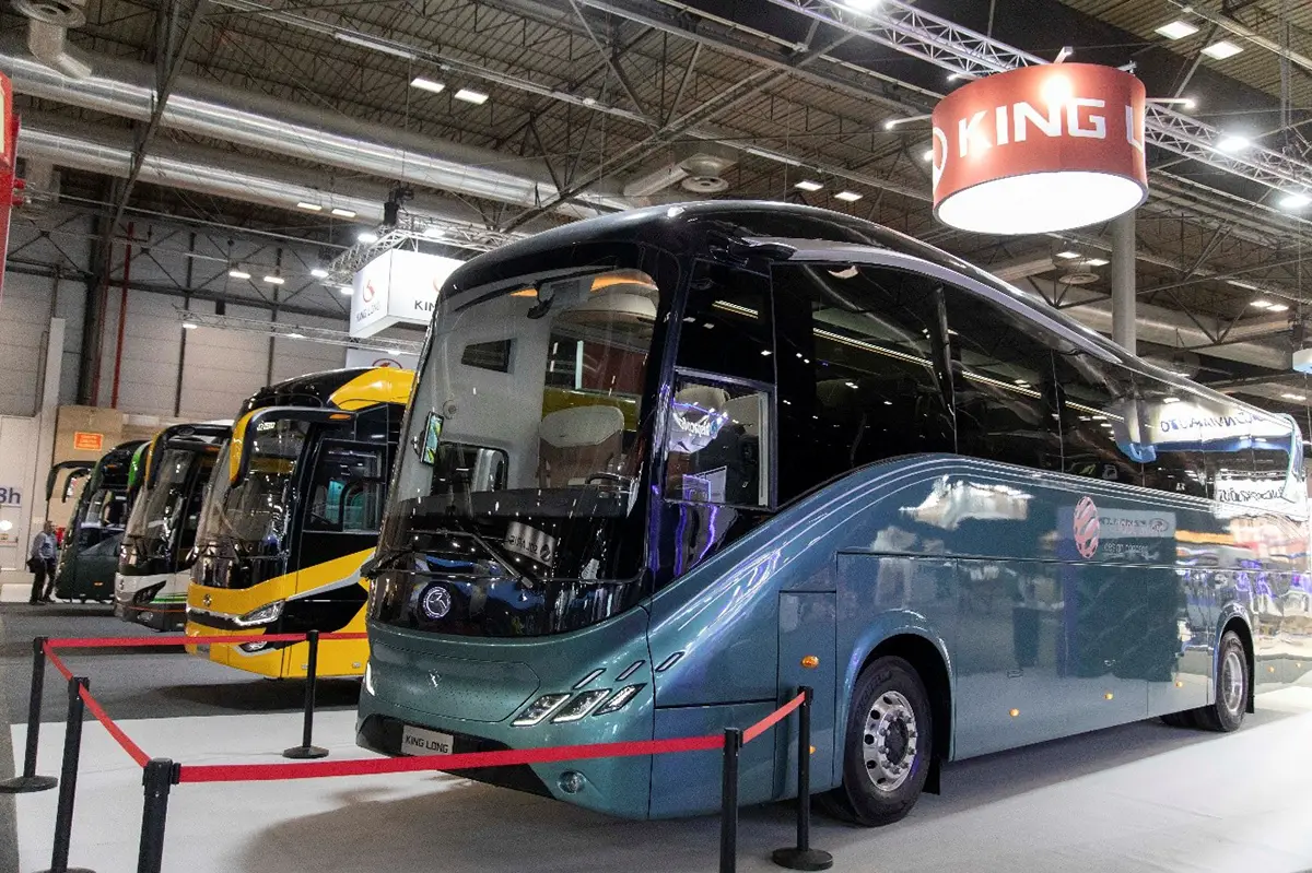 General view of the FIAA trade fair with buses and visitors.
