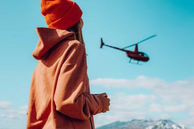 Woman watching a helicopter