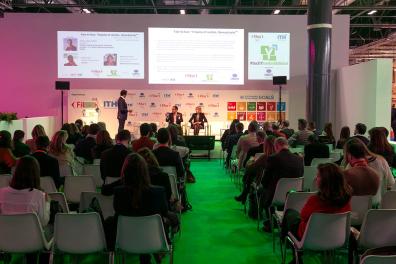 Asistentes en una conferencia de Fitur