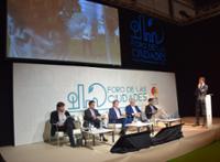 Stage with speakers at a talk.