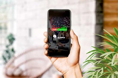 Hand holding a mobile phone with the LiveConnect app