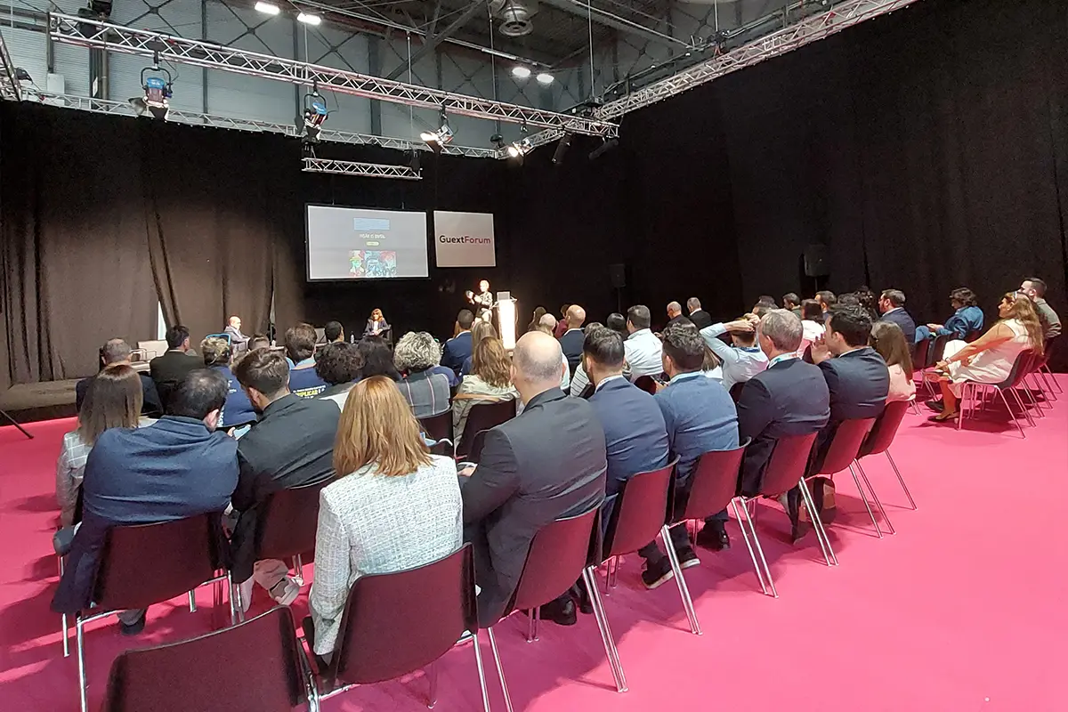 People sitting at a GUEXT conference