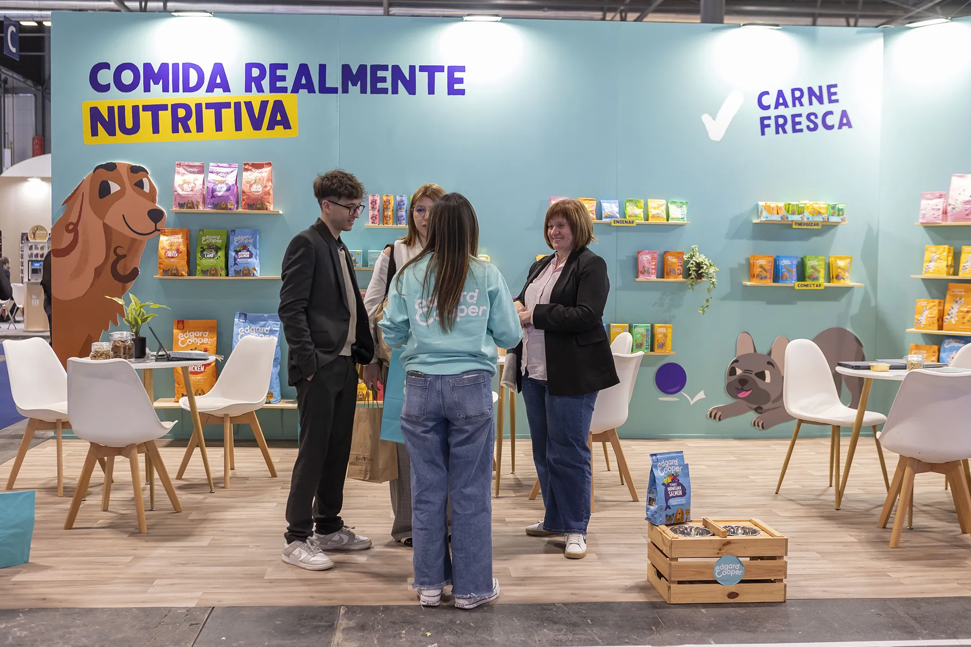 People getting information at a stand.