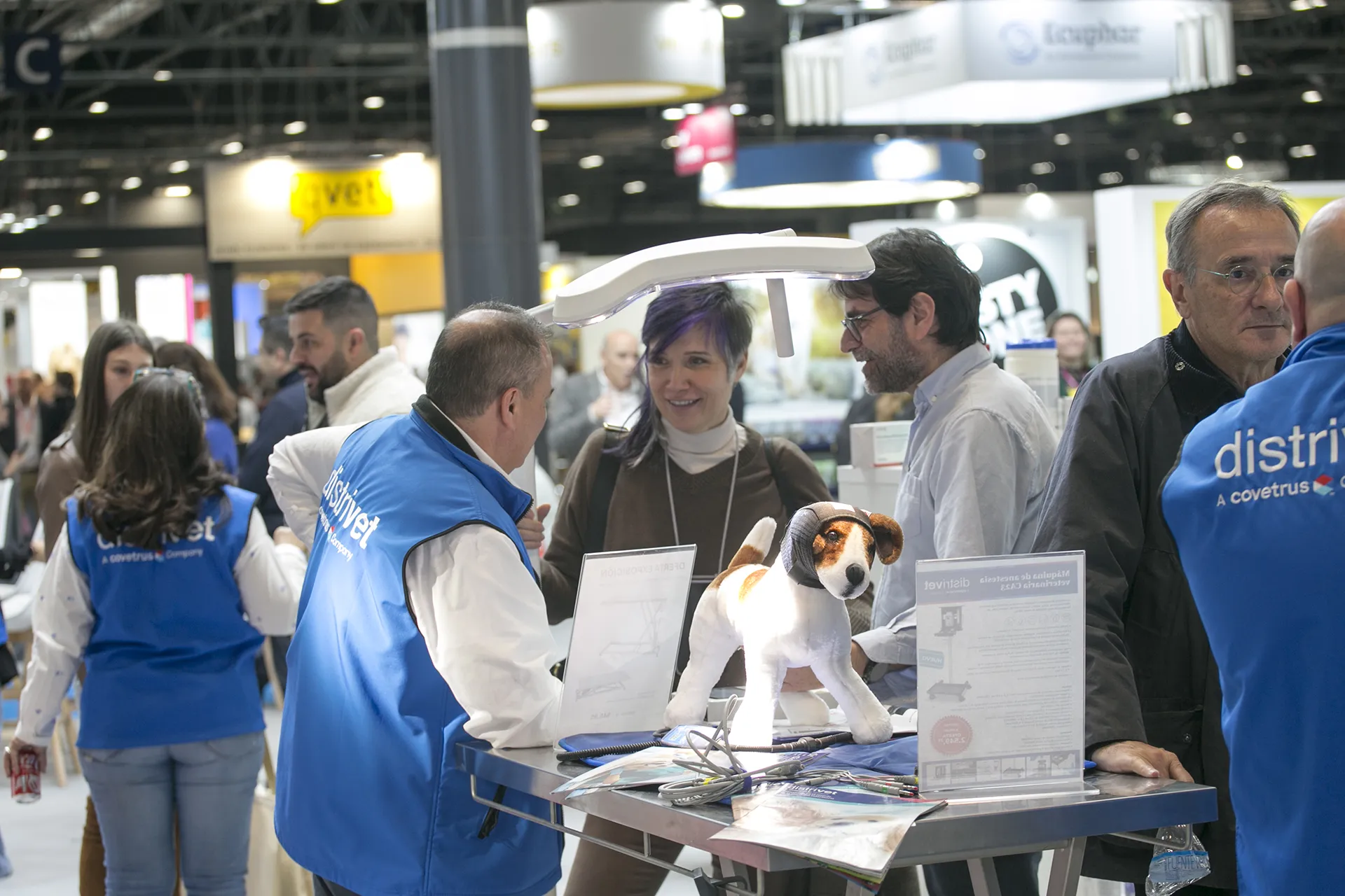 People receiving information at a stand.