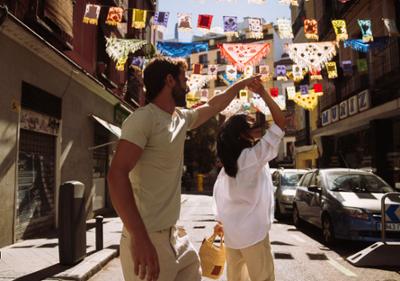 Two people dancing in the street