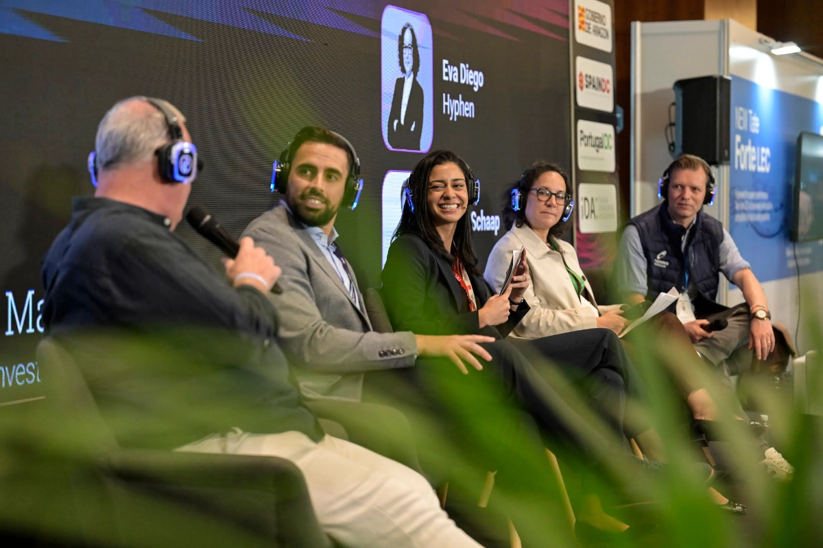 Speakers seated and speaking at DCD