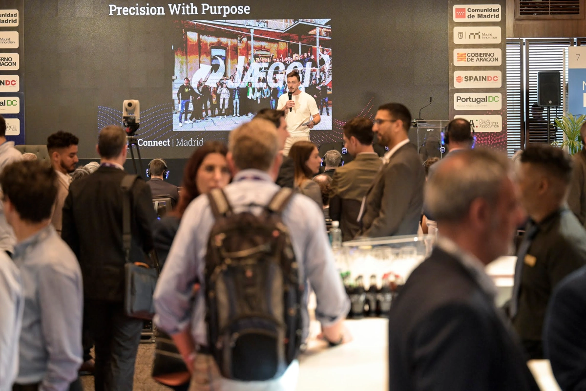Visitors browsing the booths at DCD