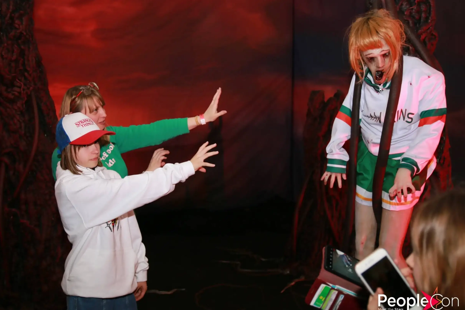 girls dressed as characters from Stranger Things posing for the photo