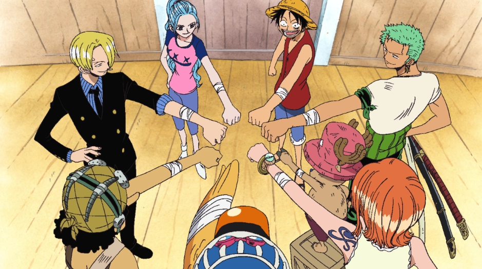 Imagen de la serie d One Piece con todos los tripulantes dandose la mano