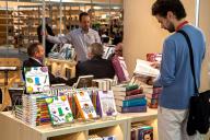 visitor observing set of books