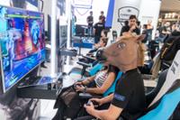 Boy with a donkey mask playing a video game.