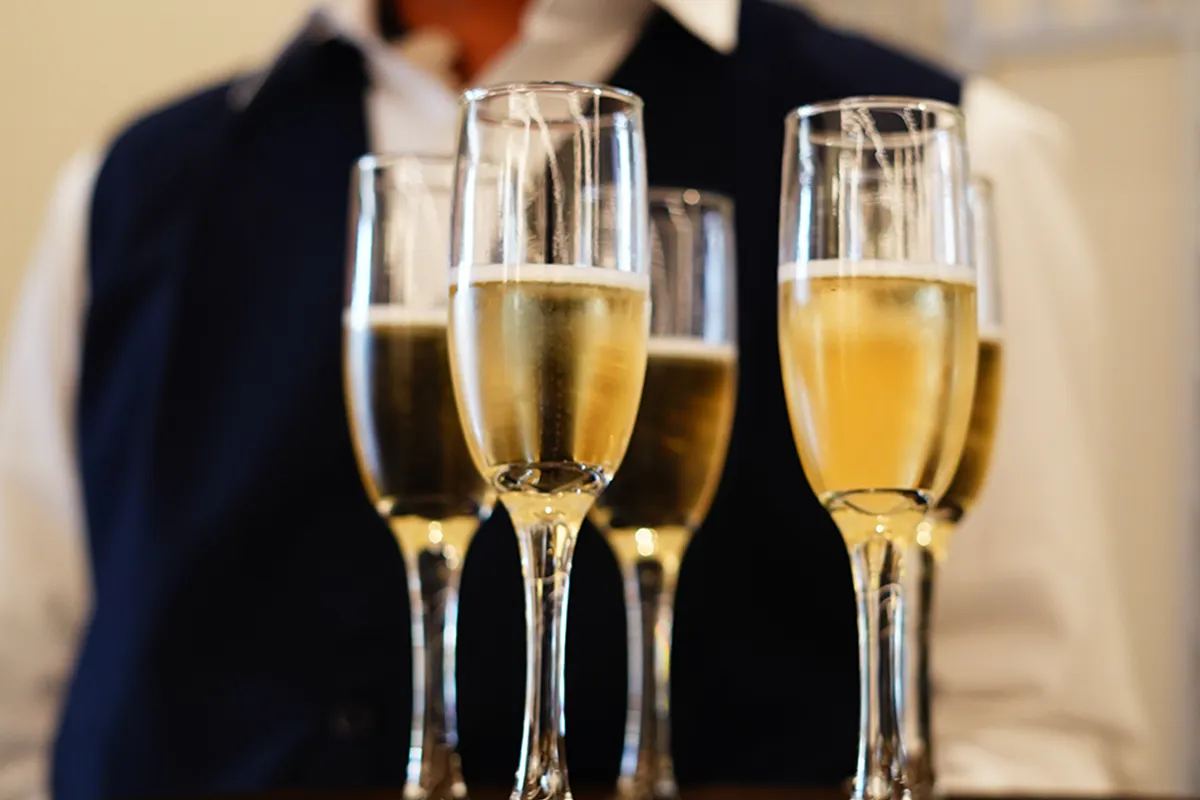 Waiter with champagne at MADRING
