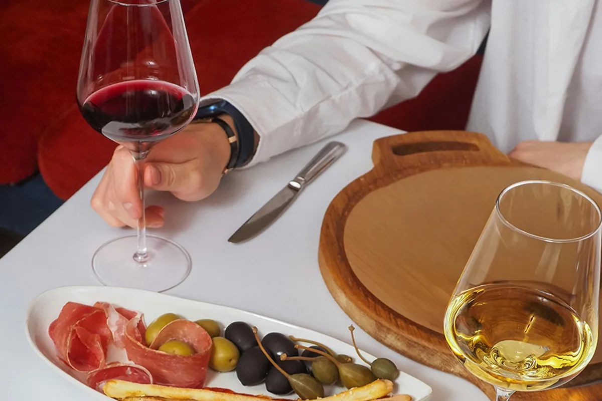 Man eating at a table in MADRING