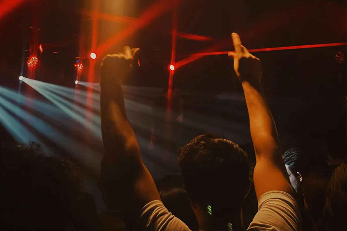 Man raising his hands and shouting in MADRING