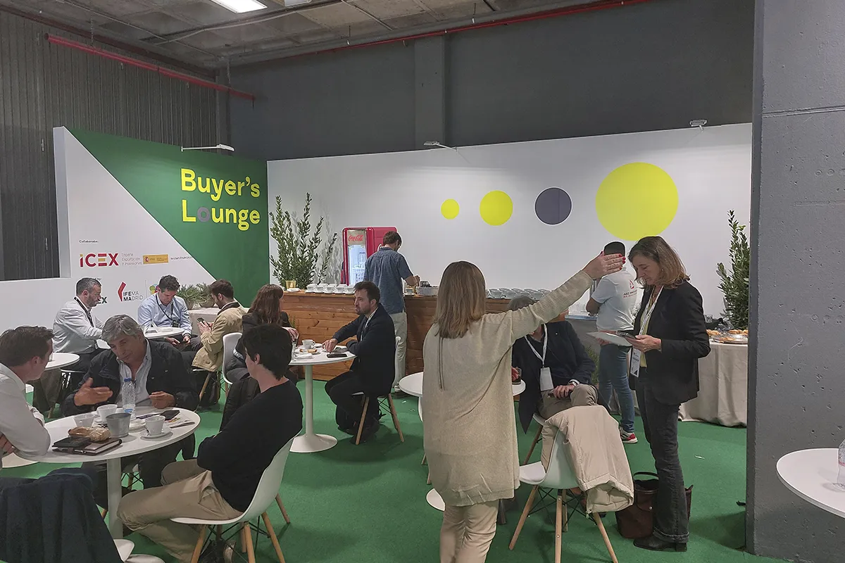 Stand with people talking at Meat Attraction