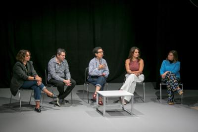 People at a conference around a table at Momad