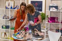 Two women looking at shoes