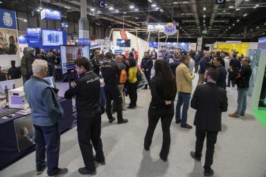Two professionals with their trolleys entering one of the SICUR pavilions.