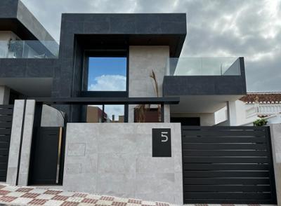A design house with modernist lines and Dooralum enclosures