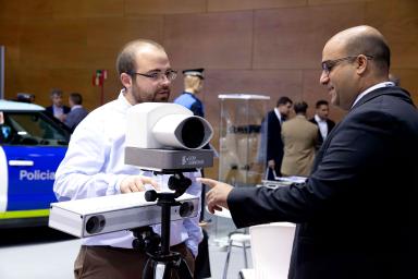 Two men discussing an exhibition product
