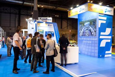 Visitors standing at the DGT stand