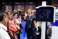 Professional of the fair explaining one of the technological devices